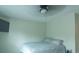 Bedroom with ceiling fan and large TV at 5800 Oakdale Rd # 103, Mableton, GA 30126