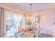 Bright dining room with hardwood floors and a view of the backyard at 5800 Oakdale Rd # 103, Mableton, GA 30126