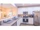 Modern kitchen features stainless steel appliances and ample counter space at 5800 Oakdale Rd # 103, Mableton, GA 30126