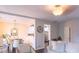 Open living room with hardwood floors and a view of the dining area and kitchen at 5800 Oakdale Rd # 103, Mableton, GA 30126