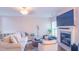 Spacious living room with a cozy fireplace and large TV at 5800 Oakdale Rd # 103, Mableton, GA 30126