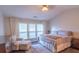 Main bedroom with king-size bed and sitting area at 5800 Oakdale Rd # 103, Mableton, GA 30126