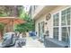 Private patio with seating area, umbrella, and grill at 5800 Oakdale Rd # 103, Mableton, GA 30126