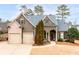 Inviting home with mature landscaping, brick accents, and a welcoming front entrance at 87 Meadow Glen Way, Acworth, GA 30101