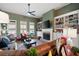 Warm and inviting living room featuring a cozy seating area, fireplace, and custom built-in shelving at 87 Meadow Glen Way, Acworth, GA 30101