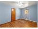 Light blue bedroom with hardwood floors and ceiling fan at 108 Woodhaven Dr, Stockbridge, GA 30281