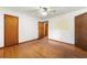 Spacious bedroom with hardwood floors and ceiling fan at 108 Woodhaven Dr, Stockbridge, GA 30281