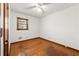 Hardwood floor bedroom with a window and ceiling fan at 108 Woodhaven Dr, Stockbridge, GA 30281