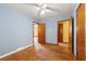 Bedroom with hardwood floors, light blue walls and ceiling fan at 108 Woodhaven Dr, Stockbridge, GA 30281