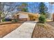 Front view of ranch home with carport and driveway at 108 Woodhaven Dr, Stockbridge, GA 30281