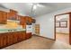 View of kitchen with wood cabinets and appliances at 108 Woodhaven Dr, Stockbridge, GA 30281