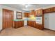 Kitchen with wood cabinets and teal countertops at 108 Woodhaven Dr, Stockbridge, GA 30281