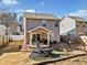 Backyard patio with seating area, fire pit, and gravel landscaping at 151 Nacoochee Way, Canton, GA 30114