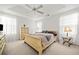 Main bedroom with light wood sleigh bed and ceiling fan at 151 Nacoochee Way, Canton, GA 30114