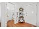 Entryway with hardwood floors, white doors, and an ornate shelf at 151 Nacoochee Way, Canton, GA 30114