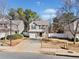 Two-story house with a gray exterior and a white fence at 151 Nacoochee Way, Canton, GA 30114