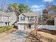 Two-story house with gray siding, white garage door, and a landscaped yard at 151 Nacoochee Way, Canton, GA 30114