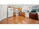 Functional kitchen with wood cabinets, white appliances, and hardwood floors at 151 Nacoochee Way, Canton, GA 30114