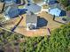 Aerial shot of a home with a cozy backyard and a small patio, situated in a peaceful residential area at 201 Augusta Walk, Canton, GA 30114