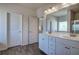 Modern bathroom with double vanity and wood-look flooring at 201 Augusta Walk, Canton, GA 30114