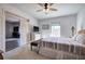 Bright bedroom with king bed, and access to another room at 201 Augusta Walk, Canton, GA 30114