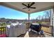 Covered deck with two grills and wooded views at 201 Augusta Walk, Canton, GA 30114