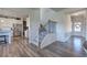 Foyer with hardwood floors, staircase, and view of the kitchen at 201 Augusta Walk, Canton, GA 30114