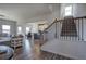 Spacious foyer with hardwood floors, view of the kitchen and staircase at 201 Augusta Walk, Canton, GA 30114