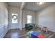 Bright foyer with hardwood floors, bench, and view of the living room at 201 Augusta Walk, Canton, GA 30114