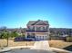 Charming two-story home with a well-manicured lawn, featuring a two-car garage and inviting curb appeal at 201 Augusta Walk, Canton, GA 30114