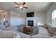 Gathering room with sectional sofa, fireplace, and hardwood floors at 201 Augusta Walk, Canton, GA 30114