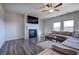 Gathering room featuring a sectional sofa and a gas fireplace at 201 Augusta Walk, Canton, GA 30114