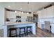 Modern kitchen with white cabinets, granite countertops, and island at 201 Augusta Walk, Canton, GA 30114