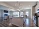 Open concept kitchen with island, living area view, and hardwood floors at 201 Augusta Walk, Canton, GA 30114