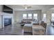 Living room with hardwood floors, sectional sofa, and fireplace at 201 Augusta Walk, Canton, GA 30114