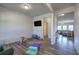 Spacious living room with hardwood floors and a view into the kitchen at 201 Augusta Walk, Canton, GA 30114