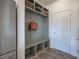 Mudroom with built-in bench, cubbies, and hooks at 201 Augusta Walk, Canton, GA 30114