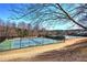 Well-maintained community tennis courts with nets and lighting, perfect for sports enthusiasts at 201 Augusta Walk, Canton, GA 30114