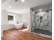 Modern bathroom featuring a glass shower, soaking tub, and neutral colors for a relaxing feel at 3520 Still Rd, Cumming, GA 30041