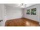 Bright bedroom with hardwood floors, a large window and white paint at 3520 Still Rd, Cumming, GA 30041