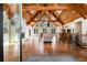 Bright and spacious living area featuring a vaulted wood ceiling, fireplace, and hardwood floors at 3520 Still Rd, Cumming, GA 30041