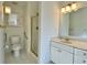 Clean bathroom features shower, toilet and vanity with storage at 4299 High Country Dr, Douglasville, GA 30135