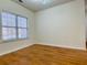 Simple bedroom with hardwood floors and a large window at 4299 High Country Dr, Douglasville, GA 30135