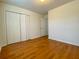 Bright bedroom includes hardwood floors and double doors to closet at 4299 High Country Dr, Douglasville, GA 30135