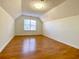 Bedroom with hardwood floors, sloped ceilings and window at 4299 High Country Dr, Douglasville, GA 30135