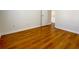 Well-lit bedroom featuring hardwood floors and a door at 4299 High Country Dr, Douglasville, GA 30135