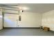 Spacious garage with light grey flooring and white walls at 4299 High Country Dr, Douglasville, GA 30135