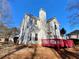 Rear view of two-story house with red deck at 4299 High Country Dr, Douglasville, GA 30135