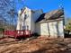 Two-story house with a red deck and vinyl siding at 4299 High Country Dr, Douglasville, GA 30135