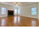 Spacious living room with hardwood floors and a stone fireplace at 4299 High Country Dr, Douglasville, GA 30135